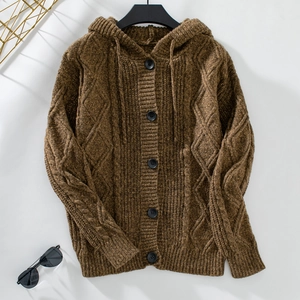 Close-up of brown cable-knit cardigan with round buttons and a drawstring hood detail