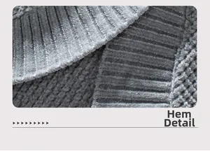 Detailaufnahme des gerippten Stricksaums an einer langen grauen Kapuzenstrickjacke