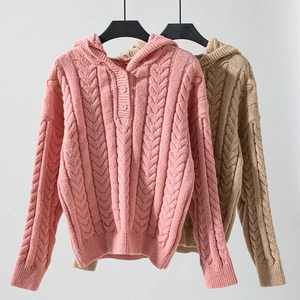 Detail of cable knit hooded sweater with vintage buttons in pink and khaki colors