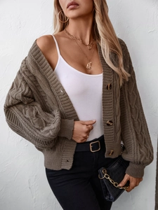Chunky knit brown cable cardigan with vintage patterns and cozy button-up sweater design