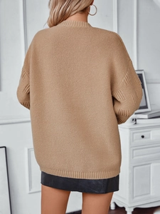 Back view of khaki oversized open-front knit cardigan with waffle textured sleeves