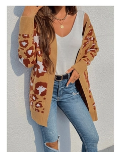 Outdoor shot of a long leopard print knit cardigan with a stylish animal pattern texture