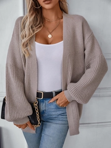 Brown knit cardigan sweater with chunky texture and casual oversized drop shoulder design