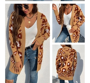 Detail of long-line leopard print knit cardigan with ribbed cuffs and open-front design