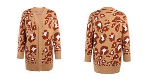 Macro view of leopard print jacquard knit pattern and ribbed hem on long cardigan
