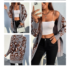 Detail of long leopard print cardigan showing ribbed cuffs and loose fit design