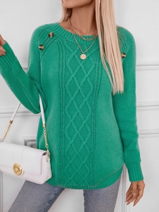 Close-up of emerald green cable knit sweater with vintage shoulder button details