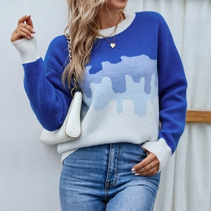 Women's crewneck knit sweater with blue colorblock drip pattern and drop shoulder design