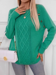 Detail of bright green cable knit sweater with vintage shoulder buttons and ribbed cuffs
