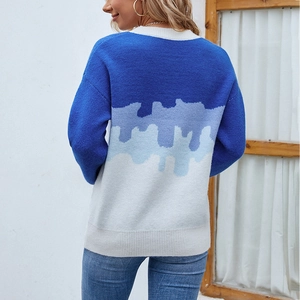 Women's crewneck knit sweater featuring a blue and white gradient patchwork design