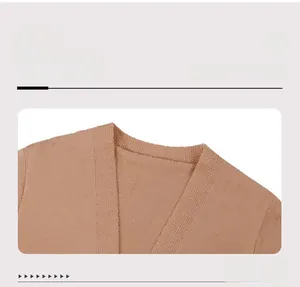 Detailed view of the V-neckline on this camel knit cardigan sweater for women