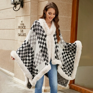 Checkerboard knit poncho with faux fur trim and elegant loose drape for winter