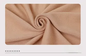 Detailed close-up of premium khaki knit fabric showing fine texture and soft elasticity