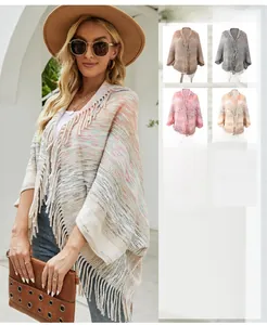 Women bohemian knit poncho shawl with long tassel hem available in five versatile colors