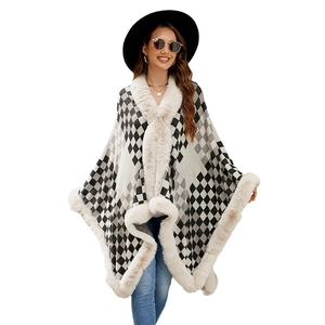 Women's plaid poncho with elegant white faux fur collar and classic black and white grid pattern