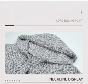 Detailaufnahme einer grauen Strickjacke mit Kapuze, Silberreißverschluss und weichem Stoff