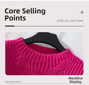 Detailed close-up of the round neckline and chunky knit texture of the fuchsia sweater