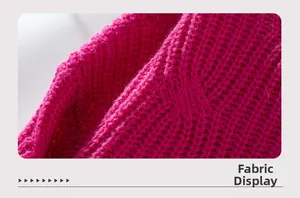 Close-up of rose red chunky knit sweater fabric showing detailed weave texture