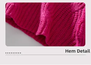 Detail view of the ribbed hem on a chunky knit rose red pullover sweater for women