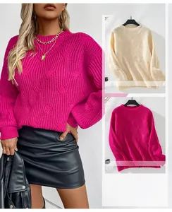 Detail of chunky cable knit sweater showing round neck and textured braided patterns