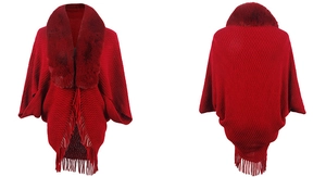 Front and back view of a red knit poncho with a faux fur collar and tassel fringe detail