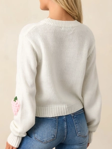 White knit sweater featuring 3D strawberry embroidery and round neck for women
