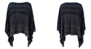 Detailed view of the striped knit poncho featuring elegant tassel fringe edges