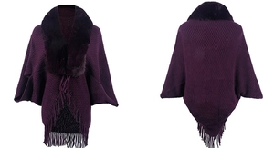 Detail of purple knit poncho featuring diamond texture, faux fur collar and long tassels