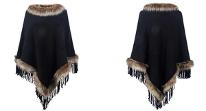 Close-up of black knitted poncho featuring faux fur trim and delicate tassel hem details
