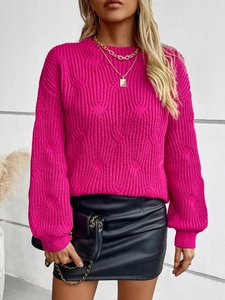 Detail of cable knit pattern on magenta crewneck sweater with lantern sleeve style