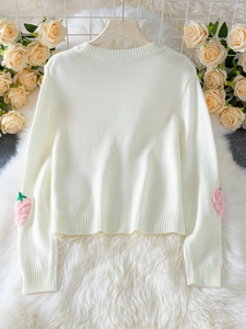 Elegant white knit sweater with 3D strawberry patches on long sleeves and ribbed trims