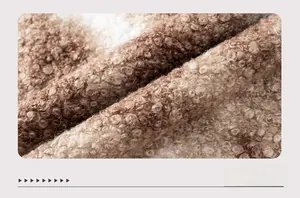 Macro shot of faux fur leopard print knit fabric with soft texture and warm tones