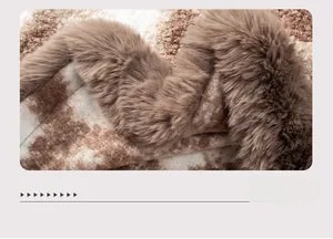 Detailed view of the thick faux fur trim and textured leopard pattern knit fabric