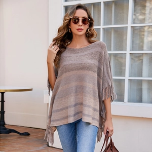 Women's knit poncho sweater featuring gradient brown stripes and tassel hem detailing