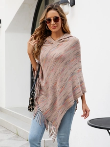 Close-up of the multi-colored striped knit poncho shawl with long fringe and hood