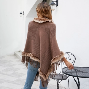 Women's brown knitted tassel poncho with faux fur trim and textured stripe pattern