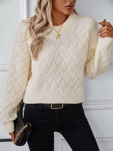 Cream white cable knit sweater with chunky diamond pattern and loose crewneck fit