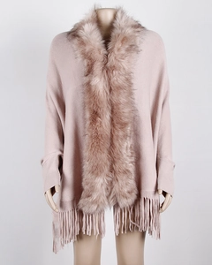 Detail of pink knitted shawl featuring plush faux fur collar and elegant fringe tassels