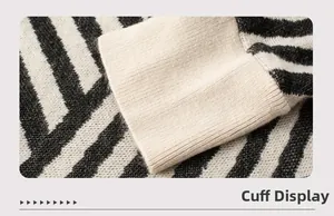 Detail of ribbed cuff on black and white striped knitted shawl with soft texture