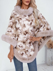 Women's marbled knit poncho sweater with faux fur trim collar and hem in a loose fit
