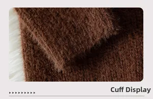 Detailed close-up of brown long-haired plush sleeve cuff on thick knit sweater