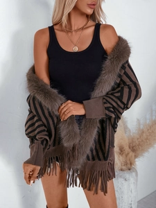 Women's striped knit poncho with fringe and faux fur collar for autumn and winter style