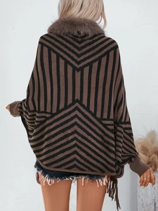 Women striped knit poncho with brown faux fur collar and fringe hem in dark coffee tones