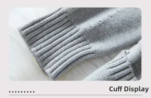 Detailed macro view of light gray knit cardigan cuffs with ribbing and openwork patterns