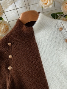 Two-tone knit sweater with gold buttons and mock neck in brown and cream fuzzy fabric