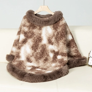 Detail of knit poncho with plush faux fur collar and hem in a warm brown leopard pattern