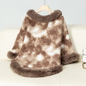 Detailed view of leopard print knit poncho with luxurious faux fur collar and trim