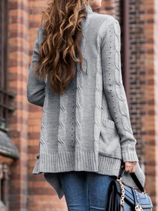 Women's gray cable knit cardigan with pockets and long sleeves in a casual open-front style