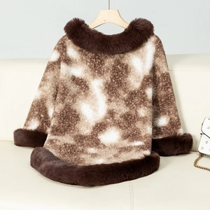 Close-up of leopard print knit poncho with luxurious brown faux fur collar and trim