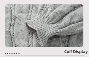 Detail of cable knit texture and elastic ribbed cuffs on a grey knit cardigan